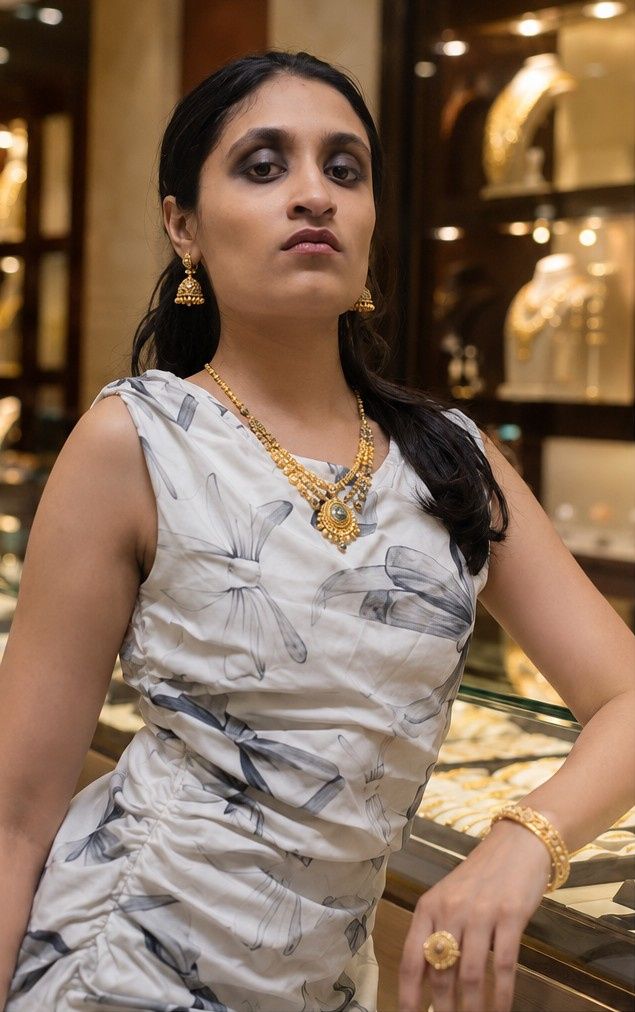 Thejaswini wearing a kasumala, temple jhumka and stone ring — Balakrishna Jewellery, Stadium, Palakkad